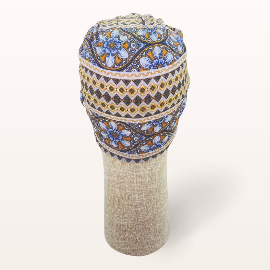 Turban de chimiothérapie Elyséa en coton doux motifs ethniques orange et marron - vue de dos